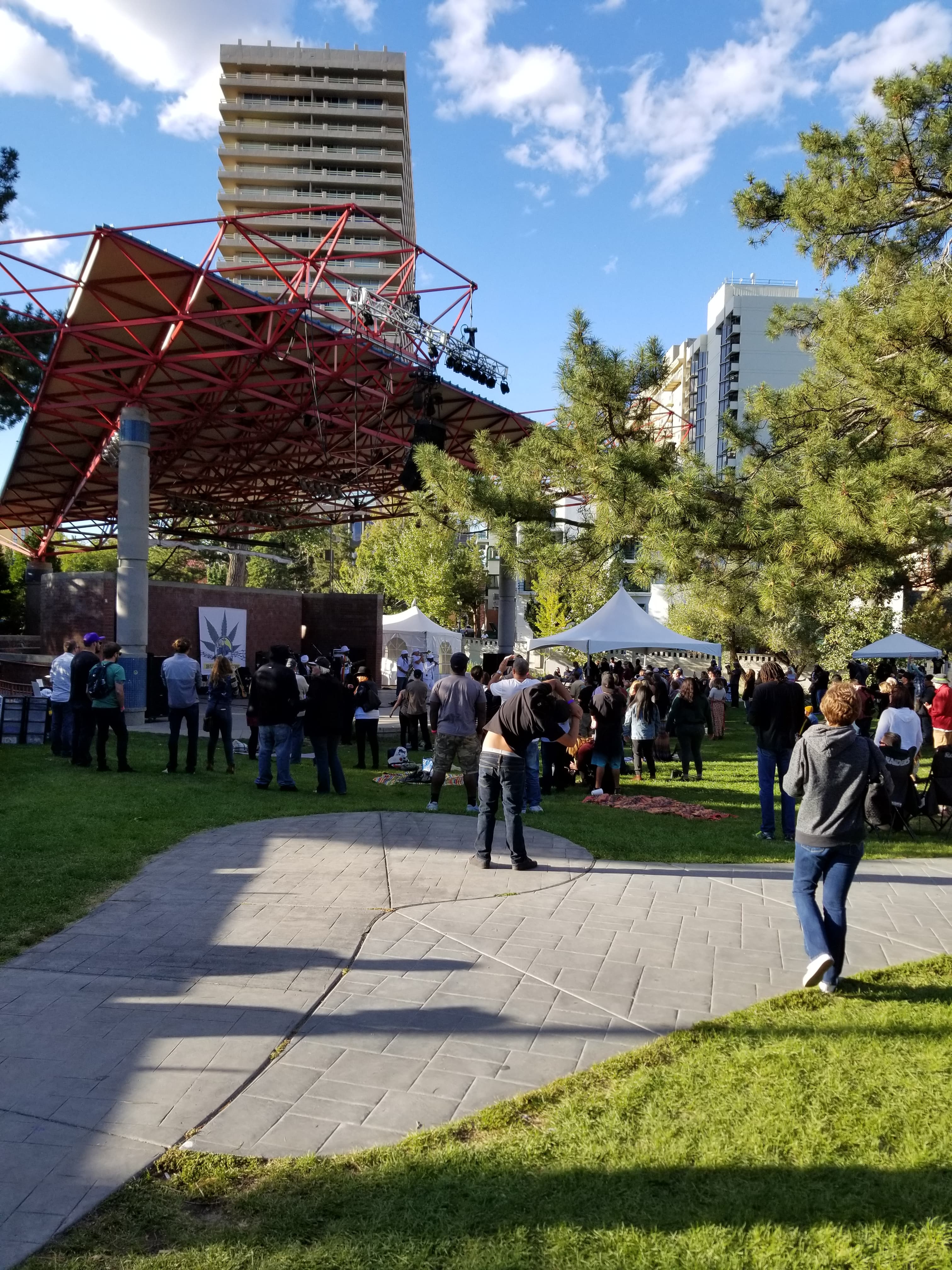 Outdoor music festival with large stage and crowd