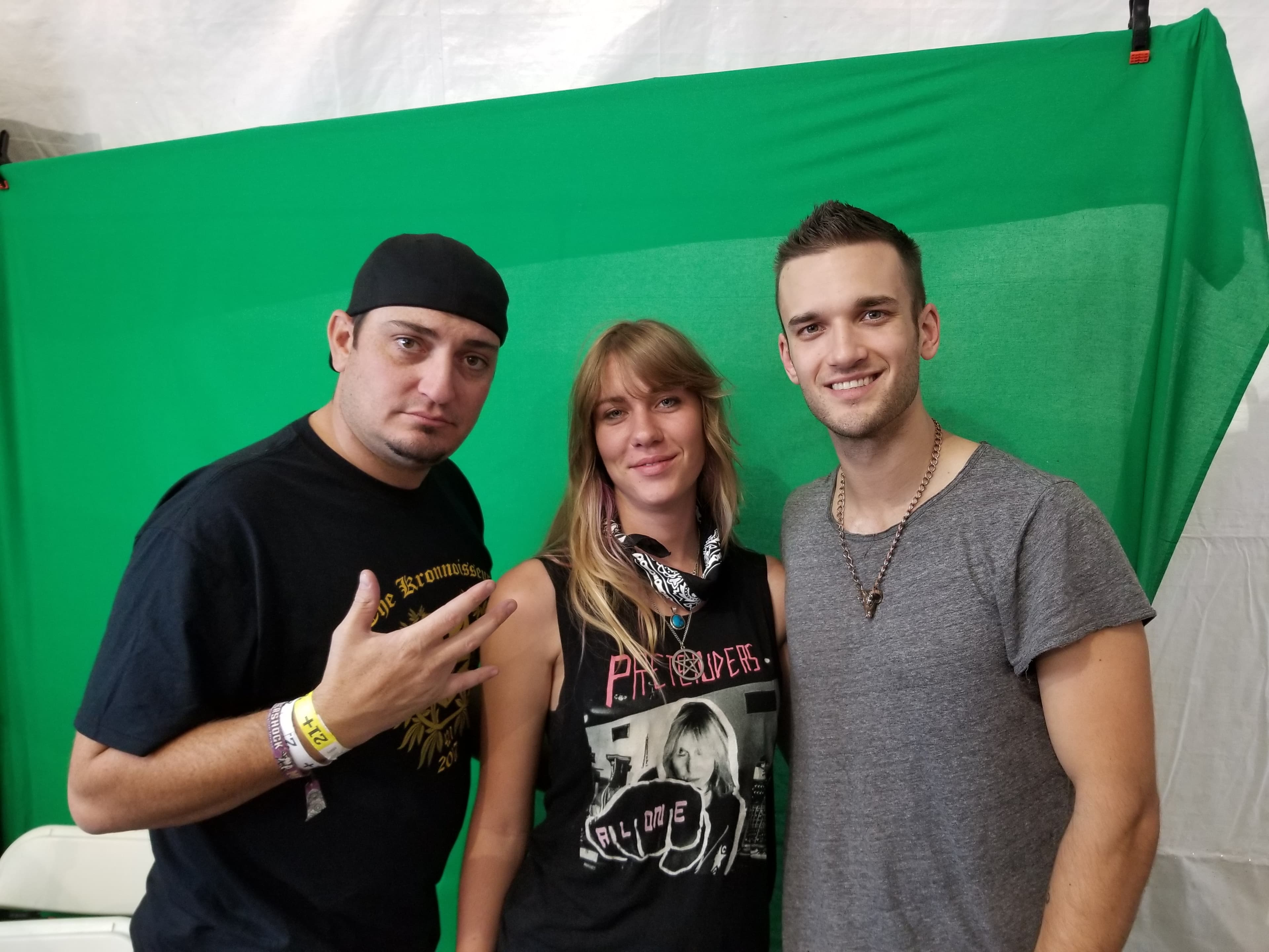 Kronik at event with green screen backdrop
